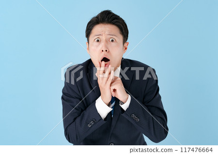 Surprised businessman overreacting Surprised businessman overreacting 117476664