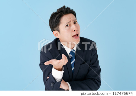 Surprised businessman overreacting Surprised businessman overreacting 117476674