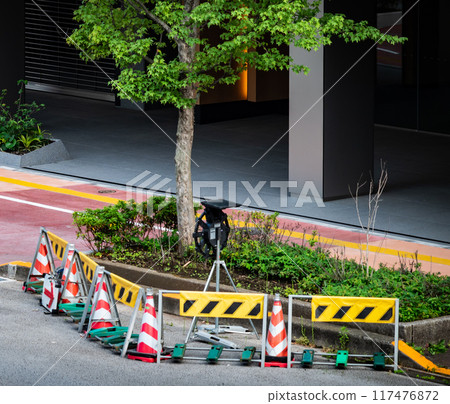 Safety fences and traffic cones installed on the road Safety fences and traffic cones installed on the road 117476872