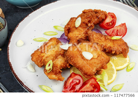 Plate of deep fried fish 117477566