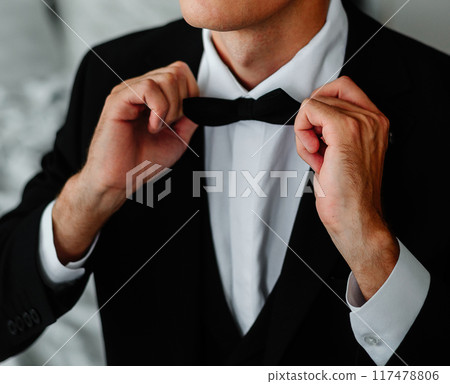 wedding preparations, groom in a suit or tuxedo, marriage proposal 117478806