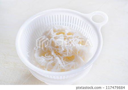 Tofu noodles in a colander 117479884