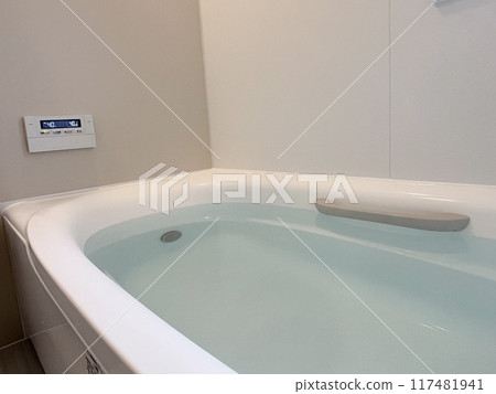 A bathtub filled with hot water A bathtub filled with hot water 117481941