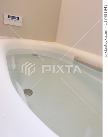 A bathtub filled with hot water A bathtub filled with hot water 117481949