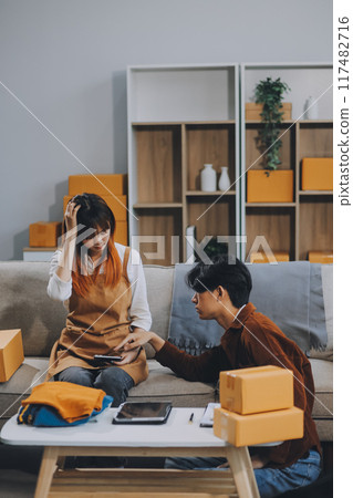 Small business owners couple entrepreneurs working with parcel, e-business, marketing, online shop, sme, entrepreneurs 117482716
