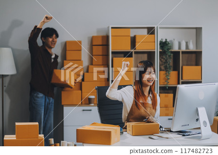 Small business owners couple entrepreneurs working with parcel, e-business, marketing, online shop, sme, entrepreneurs 117482723