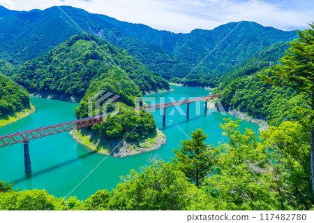 Unexplored station floating on the blue lake surface Unexplored station floating on the blue lake surface 117482780