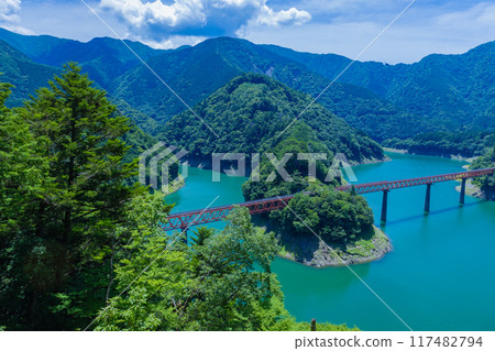 Unexplored station floating on the blue lake surface Unexplored station floating on the blue lake surface 117482794
