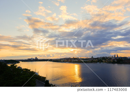 Stockholm at dusk, viewed from a hill in Sweden Stockholm at dusk, viewed from a hill in Sweden 117483008