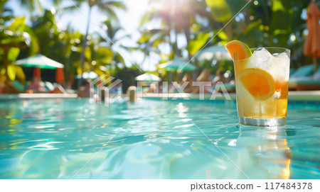 Enjoying a Refreshing Cocktail by the Poolside on a Beautiful Sunny Day, Perfect for Relaxation and Rejuvenation in Nature Enjoying a Refreshing Cocktail by the Poolside on a Beautiful Sunny Day, Perfect for Relaxation and Rejuvenation in Nature 117484378