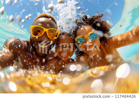 Enjoy a Fun Family Day at the Beach Experience Joyful Moments Underwater while Wearing Cool Sunglasses for Protection and Style 117484426