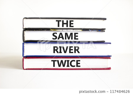 The same river twice symbol. Concept words The same river twice on books. Beautiful white table white background. Motivational business the same river twice concept. Copy space. The same river twice symbol. Concept words The same river twice on books. Beautiful white table white background. Motivational business the same river twice concept. Copy space. 117484626