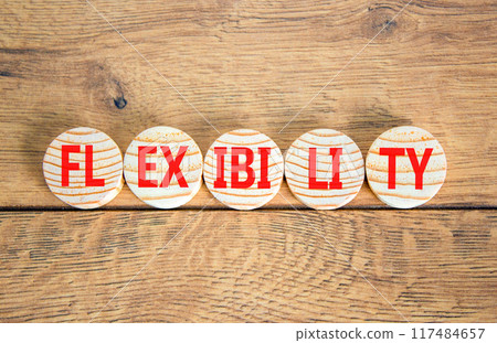 Flexibility symbol. Concept word Flexibility on beautiful wooden circles. Beautiful wooden background. Business flexibility concept. Copy space. Flexibility symbol. Concept word Flexibility on beautiful wooden circles. Beautiful wooden background. Business flexibility concept. Copy space. 117484657