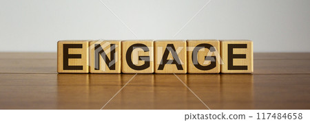 Concept word 'engage' on cubes on a beautiful wooden table Concept word 'engage' on cubes on a beautiful wooden table 117484658
