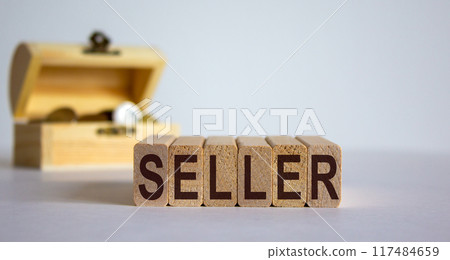 Concept word 'seller' on cubes on a beautiful white background, small chest with coins. Business concept. Copy space. Concept word 'seller' on cubes on a beautiful white background, small chest with coins. Business concept. Copy space. 117484659