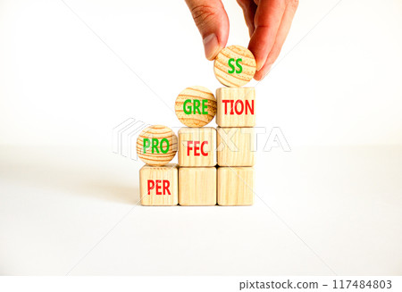 Progress or perfection symbol. Concept word Progress Perfection on beautiful wooden cubes. Beautiful white background. Businessman hand. Business progress or perfection concept. Copy space. 117484803