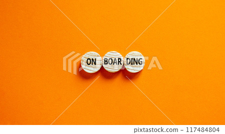 Onboarding success symbol. Concept word Onboarding on wooden circles. Beautiful orange background. Business onboarding success concept. Copy space. 117484804
