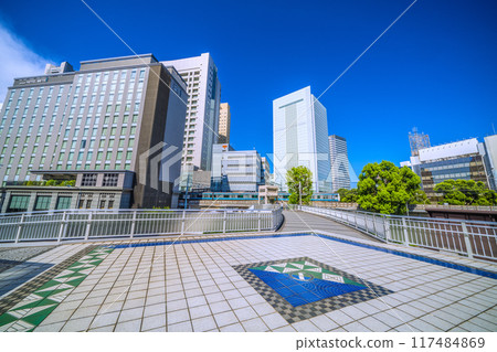 New scenery of the cityscape of Yokohama, Japan. View of the new south exit of Sakuragicho Station, Yokohama City Hall, trains, etc. = August 17, 2024 117484869