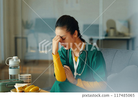 Stressing Medical Professional Taking Break at Work Stressing Medical Professional Taking Break at Work 117485065