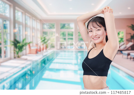 Young woman enjoying the pool Young woman enjoying the pool 117485817