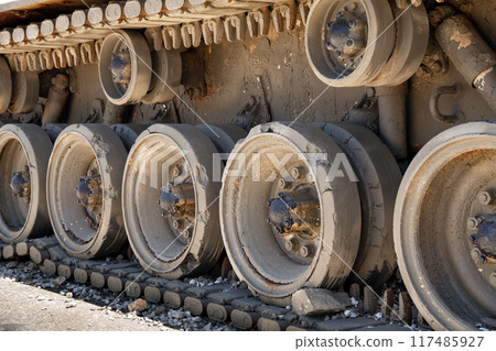 Tracks and wheels of old military tank close up Tracks and wheels of old military tank close up 117485927