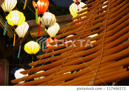 Asian lantern and bamboo folk instrument (torun) 117486572