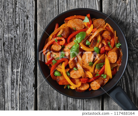 zesty italian sausage peppers and onions, top view zesty italian sausage peppers and onions, top view 117488164