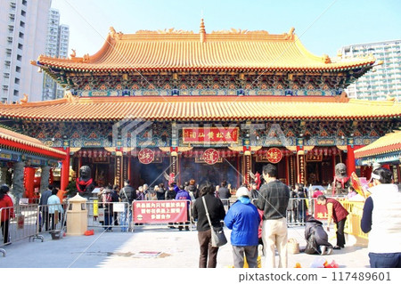 Praying at Wong Tai Sin Temple in Hong Kong before the Chinese New Year in 2011 Praying at Wong Tai Sin Temple in Hong Kong before the Chinese New Year in 2011 117489601
