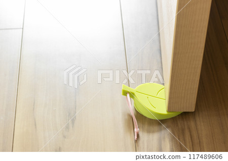 Door held open by door stopper Door held open by door stopper 117489606