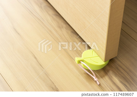 Door held open by door stopper Door held open by door stopper 117489607