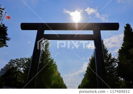 Yasukuni Shrine's first torii gate and the Japanese flag Yasukuni Shrine's first torii gate and the Japanese flag 117489852