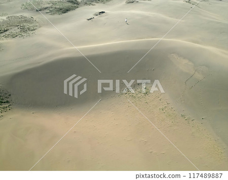 Aerial view of the Tottori Sand Dunes in the early morning with no one around Aerial view of the Tottori Sand Dunes in the early morning with no one around 117489887