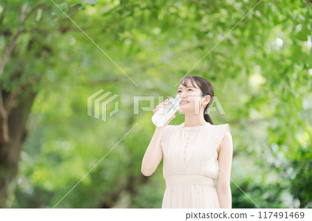 A woman with a bottle of water 117491469