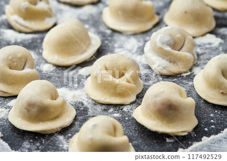 Handmade Ukrainian meat dumplings, ready for cooking, traditional varenyky with meat filling 117492529