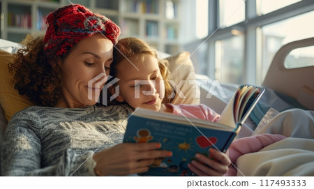 Volunteer reading a book to a child in a hospital Volunteer reading a book to a child in a hospital 117493333
