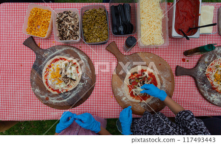 CHILDREN are preparing pizza. View from above 117493443