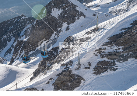 The cable car carrying tourist to Jade dragon snow mountain in Lijiang, Yunnan province of China. The cable car carrying tourist to Jade dragon snow mountain in Lijiang, Yunnan province of China. 117493669
