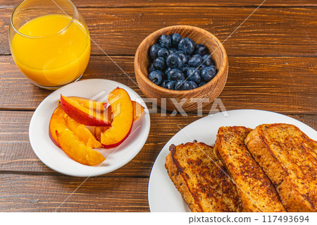 french toast on white plate for breakfast 117493694