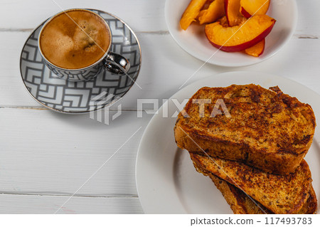 french toast on white plate for breakfast 117493783