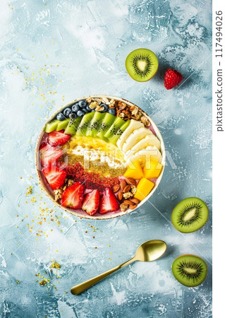 Acai bowl with a variety of tropical fruits and berries 117494026