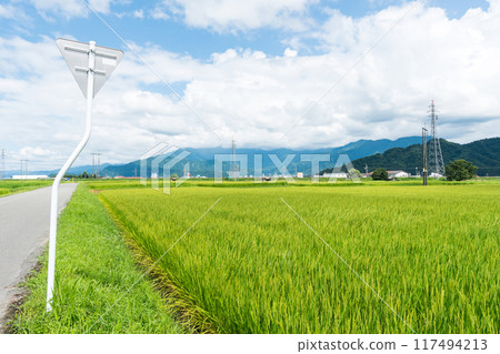 The vast rural landscape and road behind the Aeon Muikamachi store, clear blue summer sky, Minamiuonuma City, Niigata Prefecture The vast rural landscape and road behind the Aeon Muikamachi store, clear blue summer sky, Minamiuonuma City, Niigata Prefecture 117494213