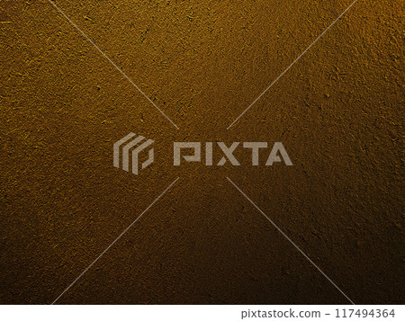 A horizontal background image of a surface that has the texture of straw remaining in a deep, dark, sand-colored earthen wall 117494364