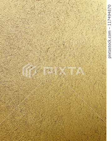 A vertically long background image of a light, sand-colored clay wall with a straw-like texture on the surface 117494870