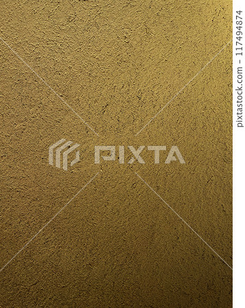 A vertical background image of a sand-colored clay wall with a surface that has the texture of straw remaining 117494874