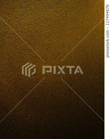 A vertical background image of a surface with a straw texture in a deep, dark sand-colored earthen wall A vertical background image of a surface with a straw texture in a deep, dark sand-colored earthen wall 117494876