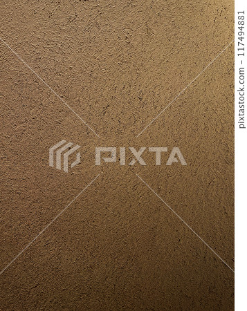 A vertically long background image of a light brown clay wall with a surface that has the texture of straw remaining 117494881