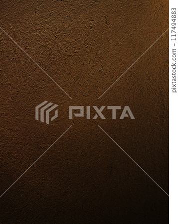 A vertically long background image of a dark, light brown earthen wall with a straw-like texture on the surface A vertically long background image of a dark, light brown earthen wall with a straw-like texture on the surface 117494883