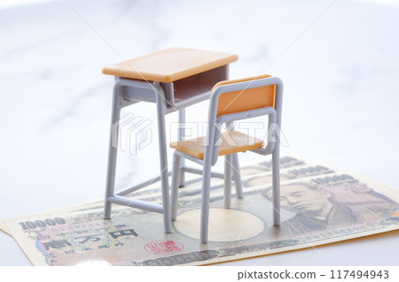 School desks and chairs, money, and rising education costs 117494943