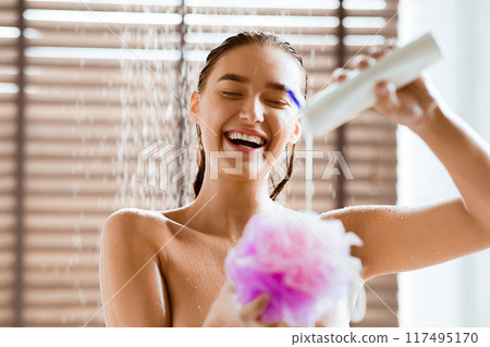 Millennial Woman Taking Shower, Putting Gel On Sponge, Free Space Millennial Woman Taking Shower, Putting Gel On Sponge, Free Space 117495170