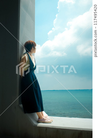 A woman looking out at the sea in Goto City, Nagasaki Prefecture 117495420